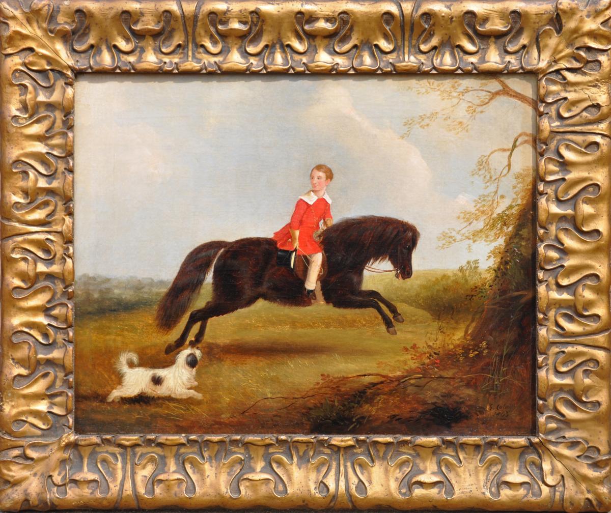 GEORGE COLE A portrait of a boy on his pony, a terrier running beside framed