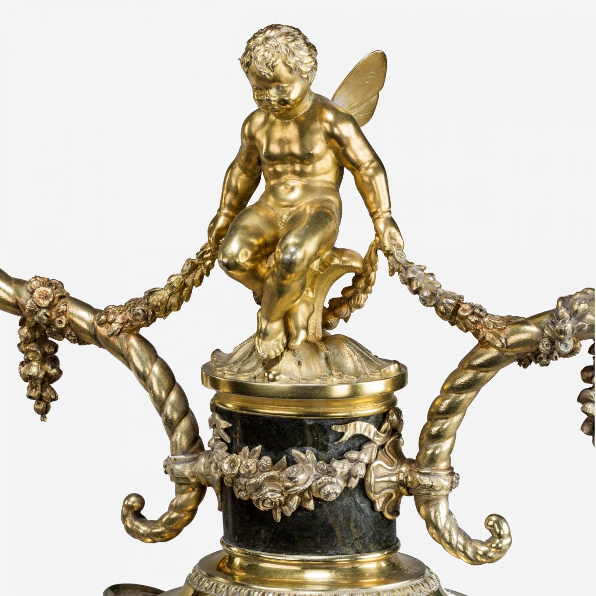 A superb pair of Victorian silver gilt candelabra