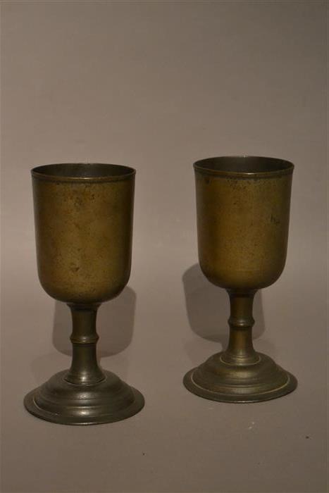 A pair of late Georgian pewter chalices