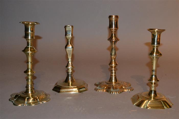 Four 18th century brass candlesticks
