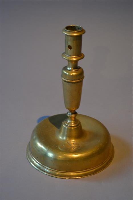 A 17th century Spanish brass candlestick