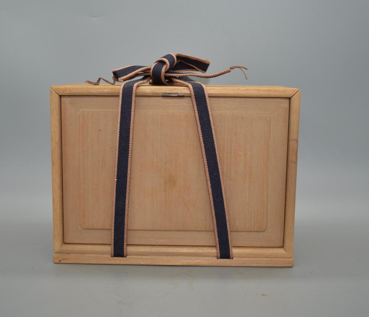 A small white glazed sake cup and tray