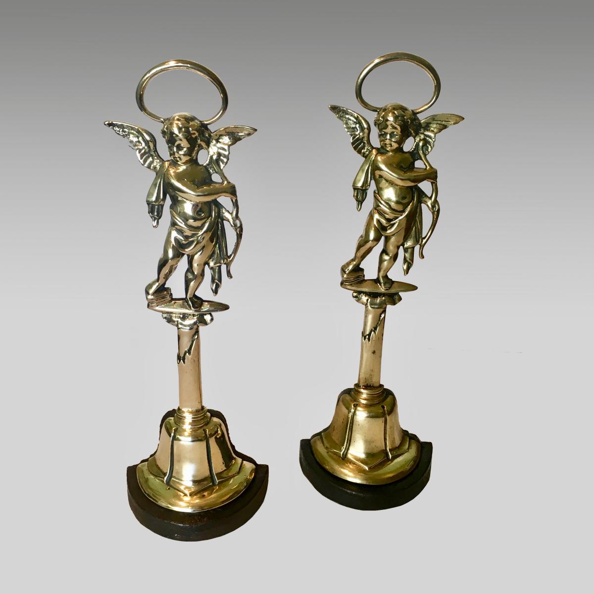 Pair brass and cast brass cherub doorstops
