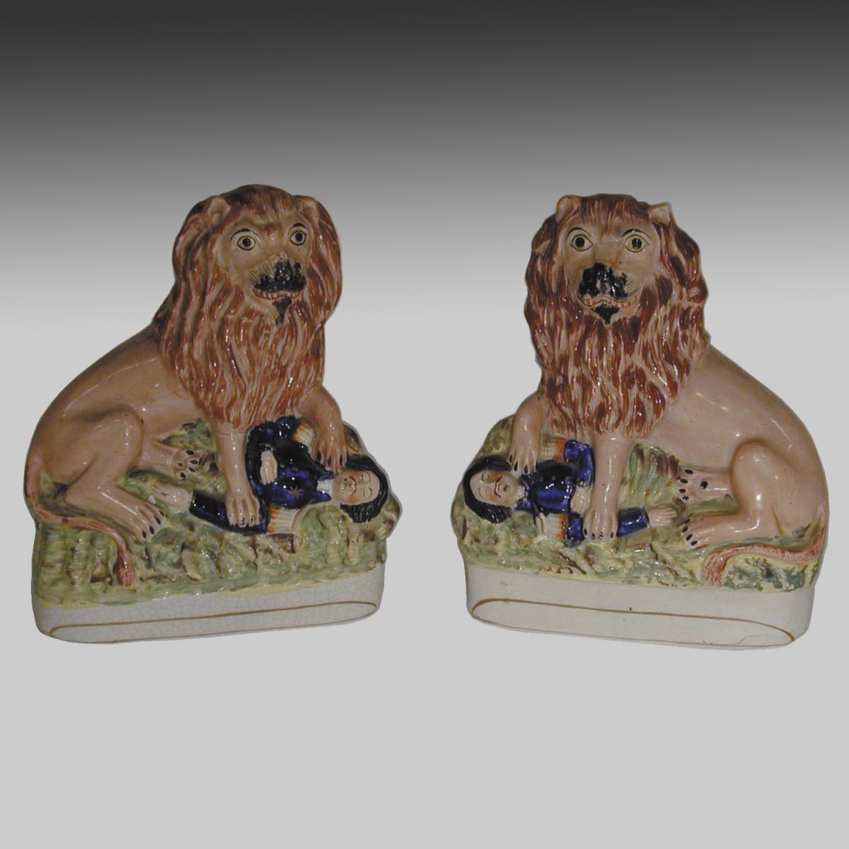 Pair of Staffordshire pottery lions