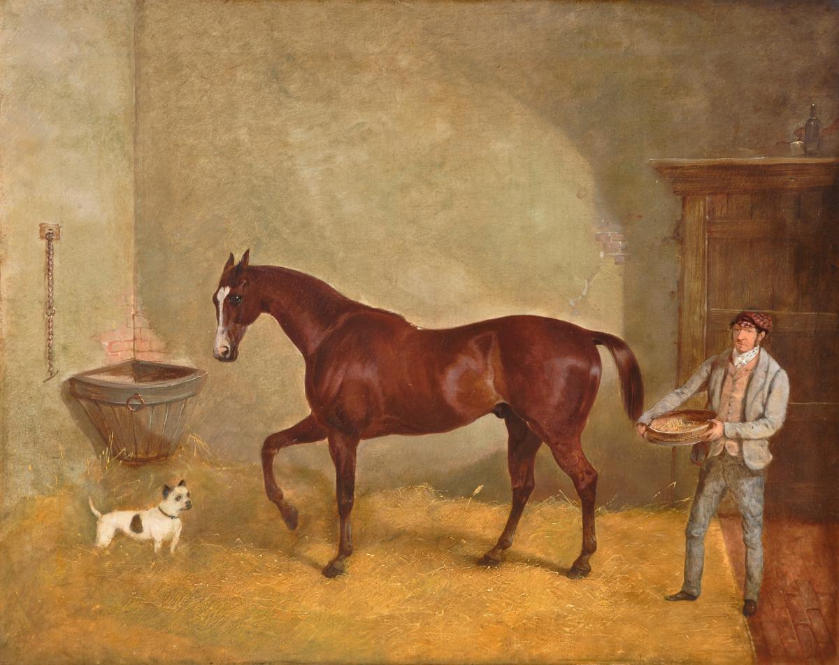 A Chestnut Hunter in a Loose Box with a Groom  by JOHN GOODE