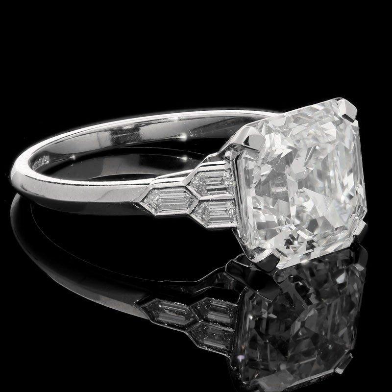 A beautiful 4.58ct Asscher cut diamond ring with honeycomb diamond-set shoulders in platinum