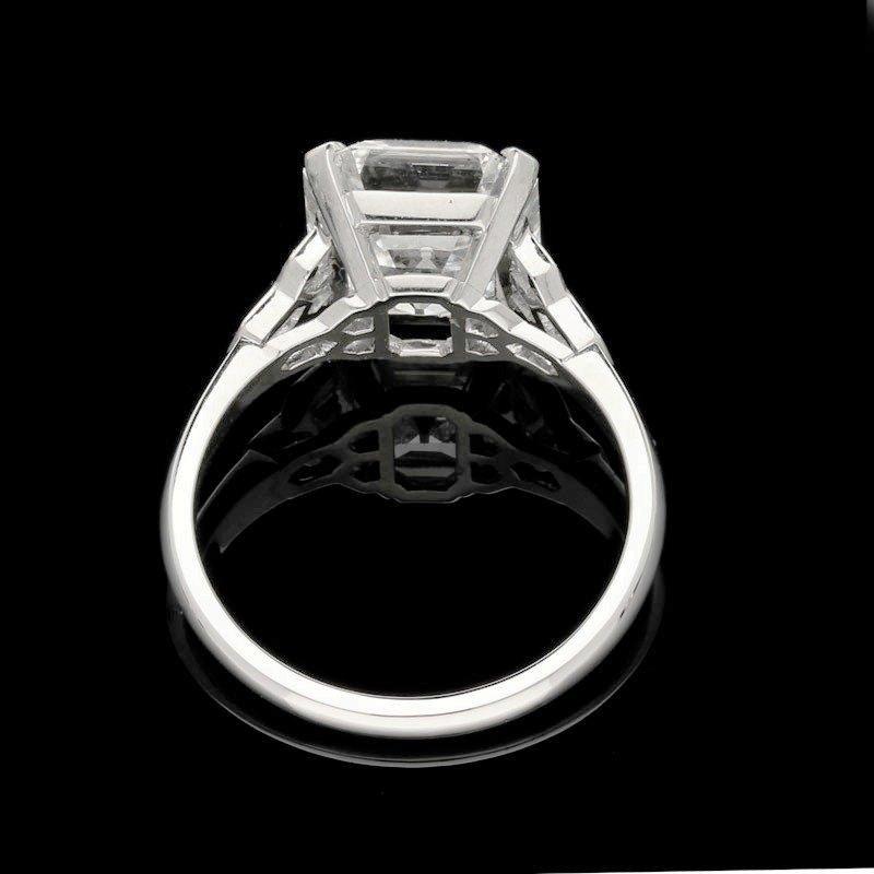 A beautiful 4.58ct Asscher cut diamond ring with honeycomb diamond-set shoulders in platinum