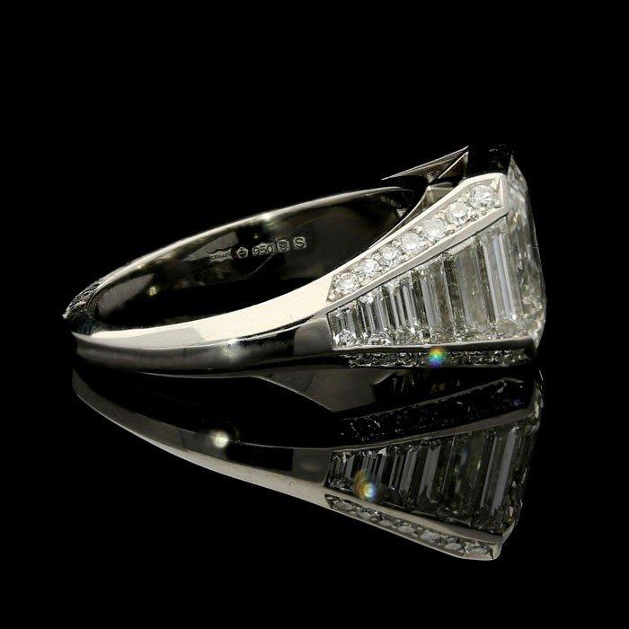 A stunning 3.02ct emerald cut diamond ring with tapering baguette and single cut diamond shoulders