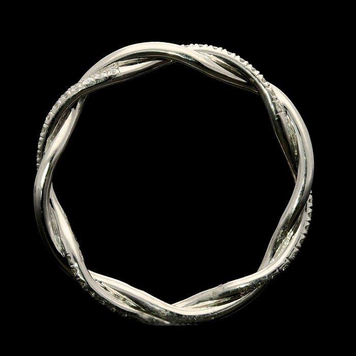 An elegant platinum fine twist ring set with round brilliant cut diamonds