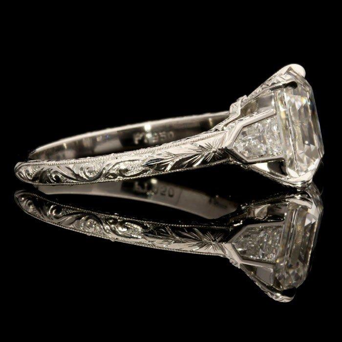 A stunning 2.81ct emerald-cut diamond ring with diamond shoulders