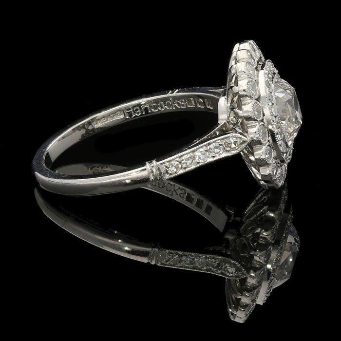 A beautiful 1.04ct old mine cushion cut diamond ring with double diamond cluster