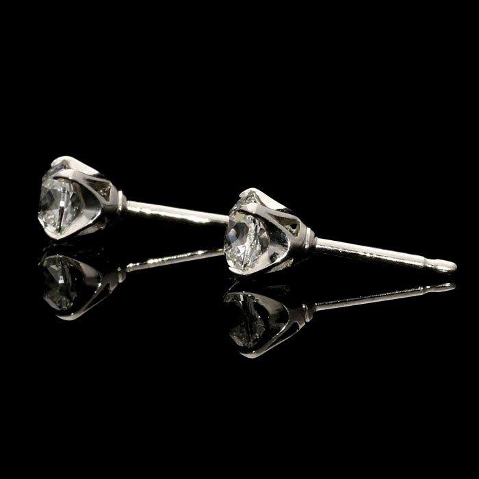 A beautiful pair of cushion shape old mine cut diamond ear studs weighing 1.42cts in total