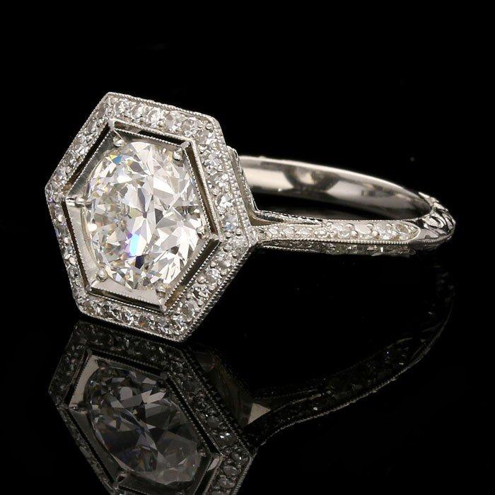 A stunning 1.83ct old European cut diamond ring with hexagonal diamond surround