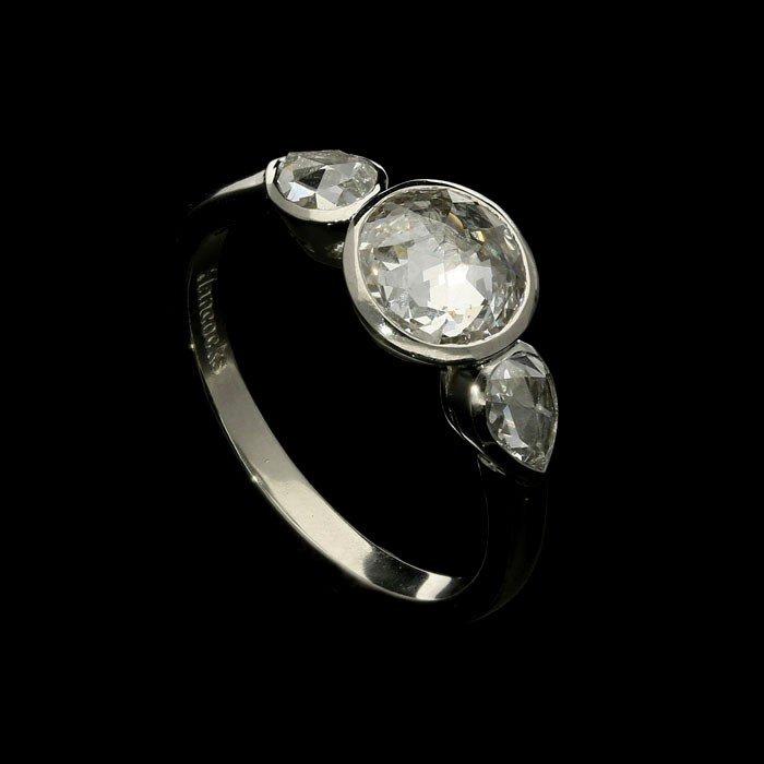 An unusual 1.01ct round and pear shape rose-cut diamond ring set in a handmade platinum mount