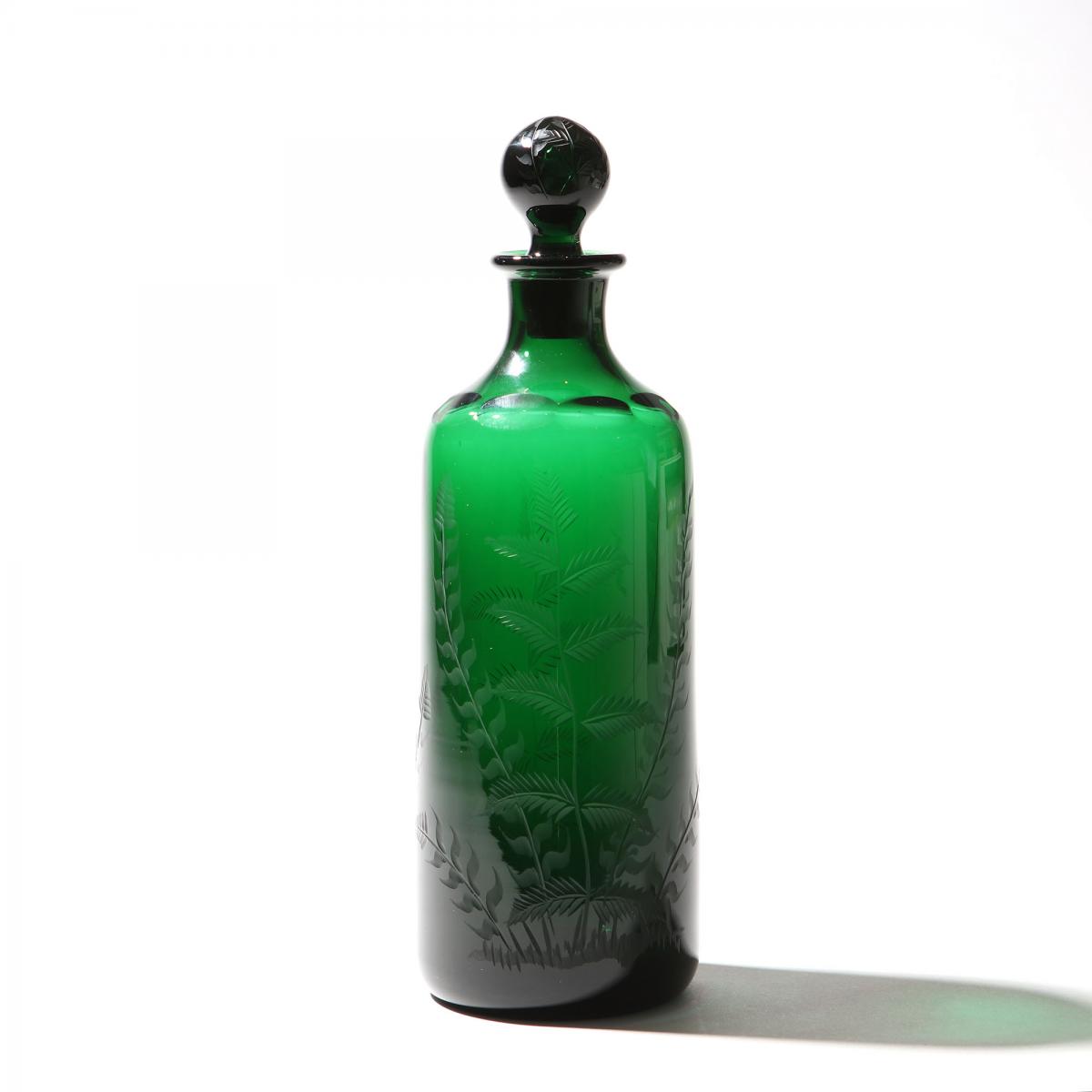 A Victorian green glass decanter
