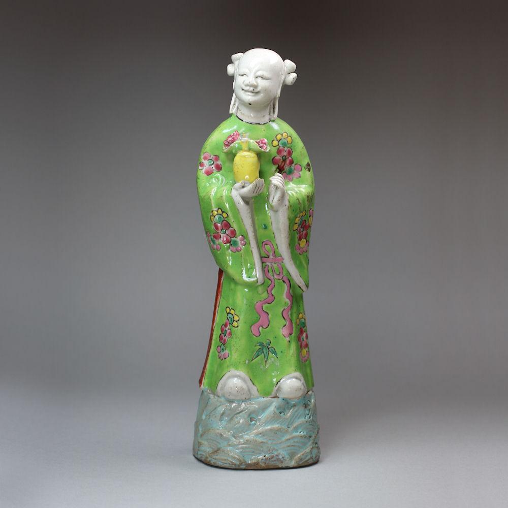 Chinese famille rose biscuit figure of the immortal Lan Caihe, Qianlong (1736-95)