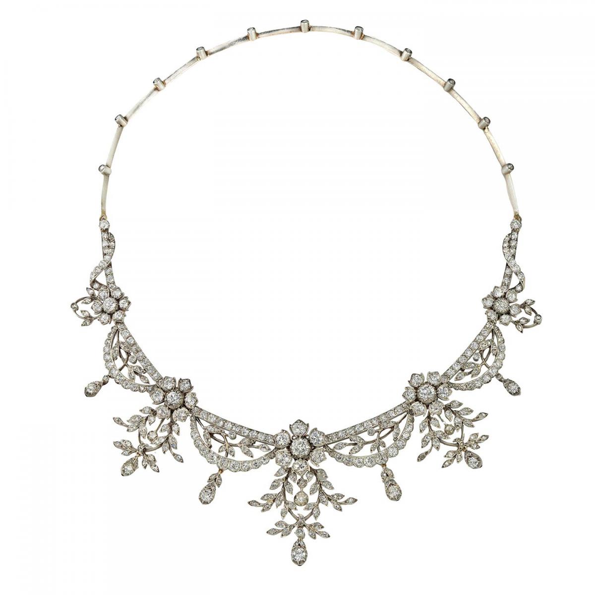 A late Victorian diamond-set tiara of floral design, consisting of five diamond-set flowers