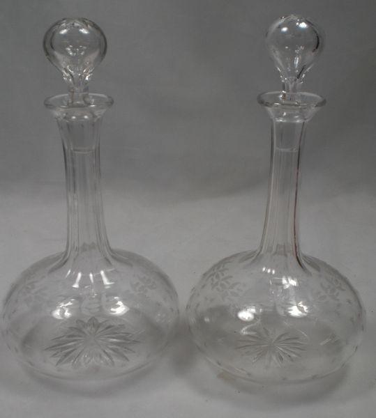 A pair of crystal glass shaft & globe decanters engraved with stars English c.1870