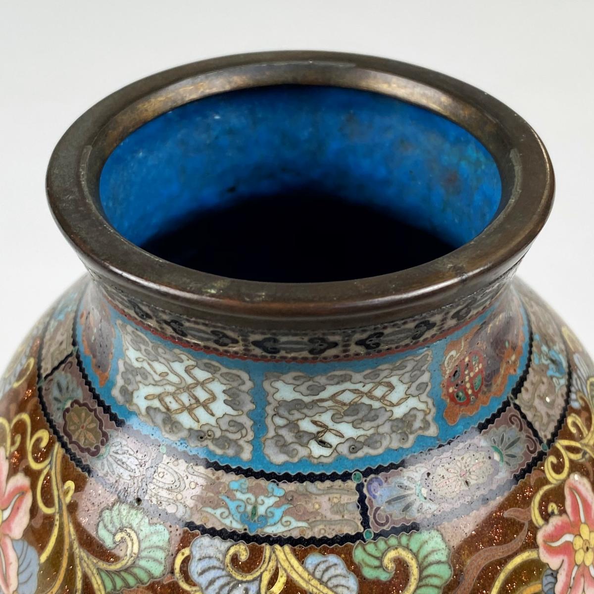 A small, yet dramatic pair of late 19th Century Japanese cloisonne vases