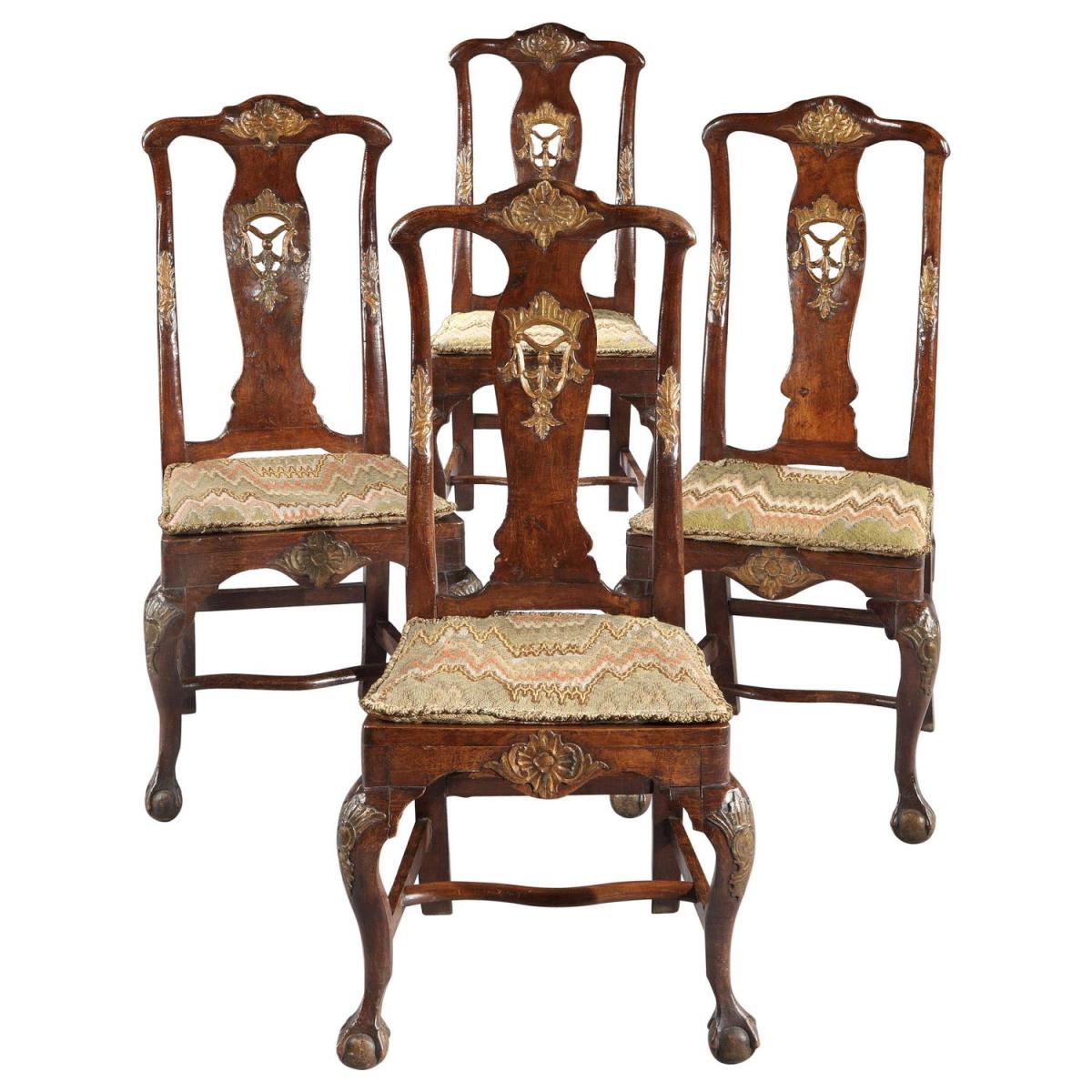 A rare, set of four, mid-18th century, Portuguese, parcel-gilt & walnut side chairs