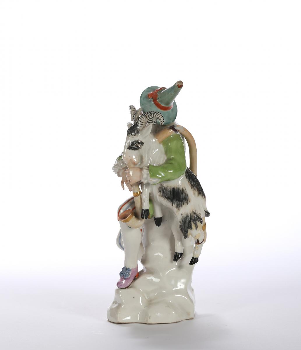 A Höchst Figure of Harlequin or Hanswurst with Bagpipe