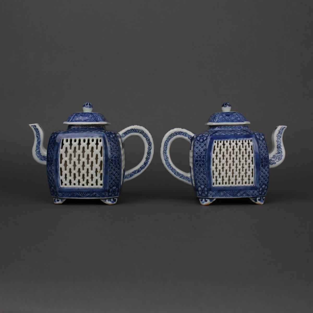 A pair of Chinese porcelain blue and white reticulated square form teapots and covers, Early Qianlong, circa 1740