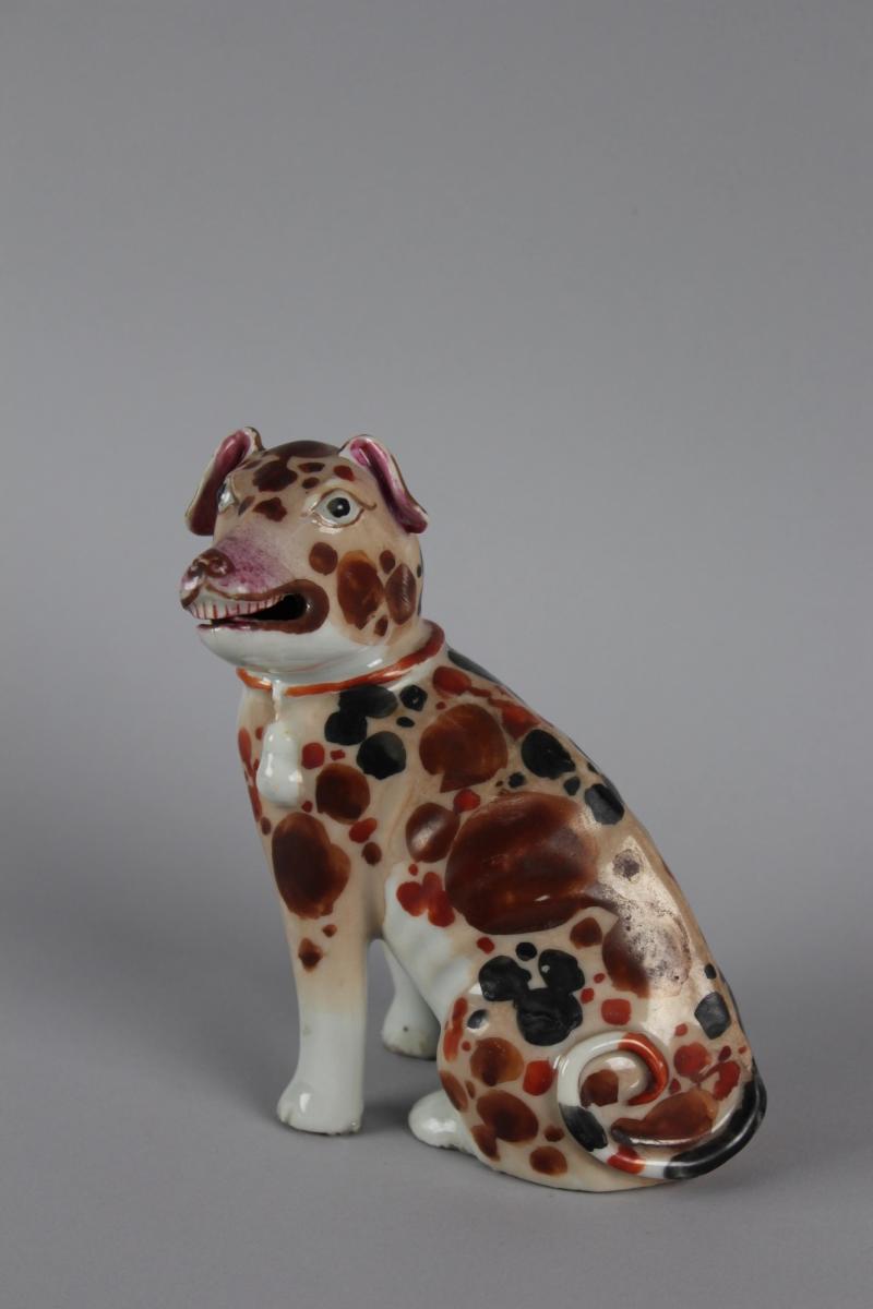 A Chinese Porcelain Model of a Seated Spotted Hound, Qing Dynasty, Qianlong Period