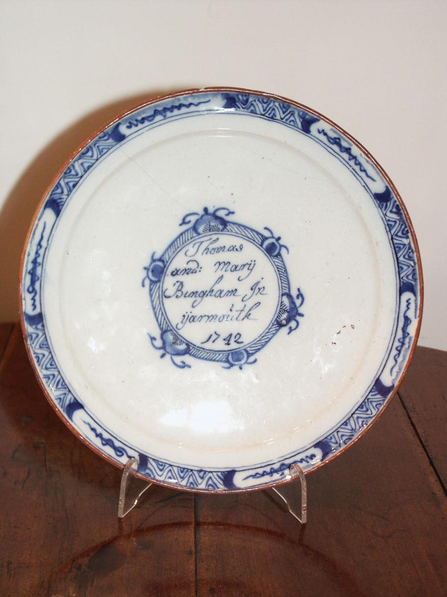 A rare, Dutch, delftware plate inscribed 'Great Yarmouth' & dated '1744'
