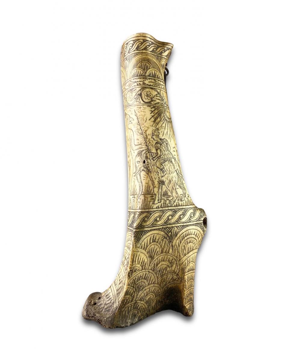 Stag antler powder flask engraved with mythical figures. German, 17th century