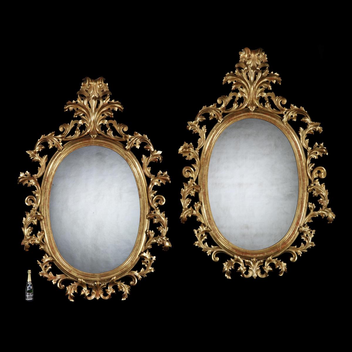 Grand Scale Pair of 19th Century Oval Florentine Carved Gilt Wood Mirrors