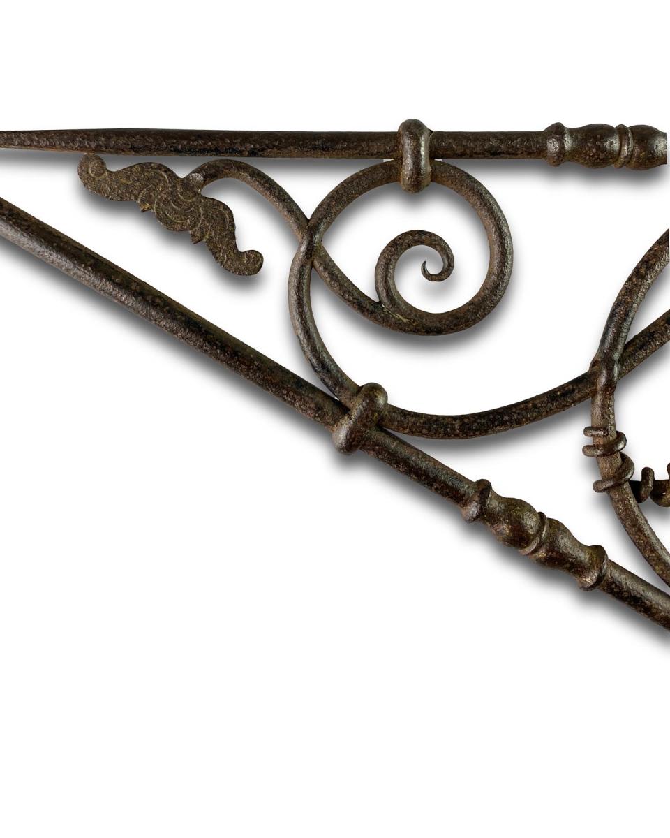 Pair of hinged wrought iron wall brackets. German, early 19th century