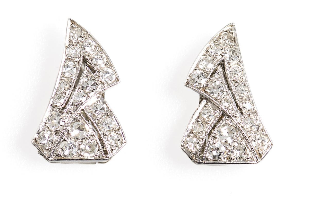 Art Deco Diamond Earrings of Stylised Ribbons in Platinum, French circa 1925.