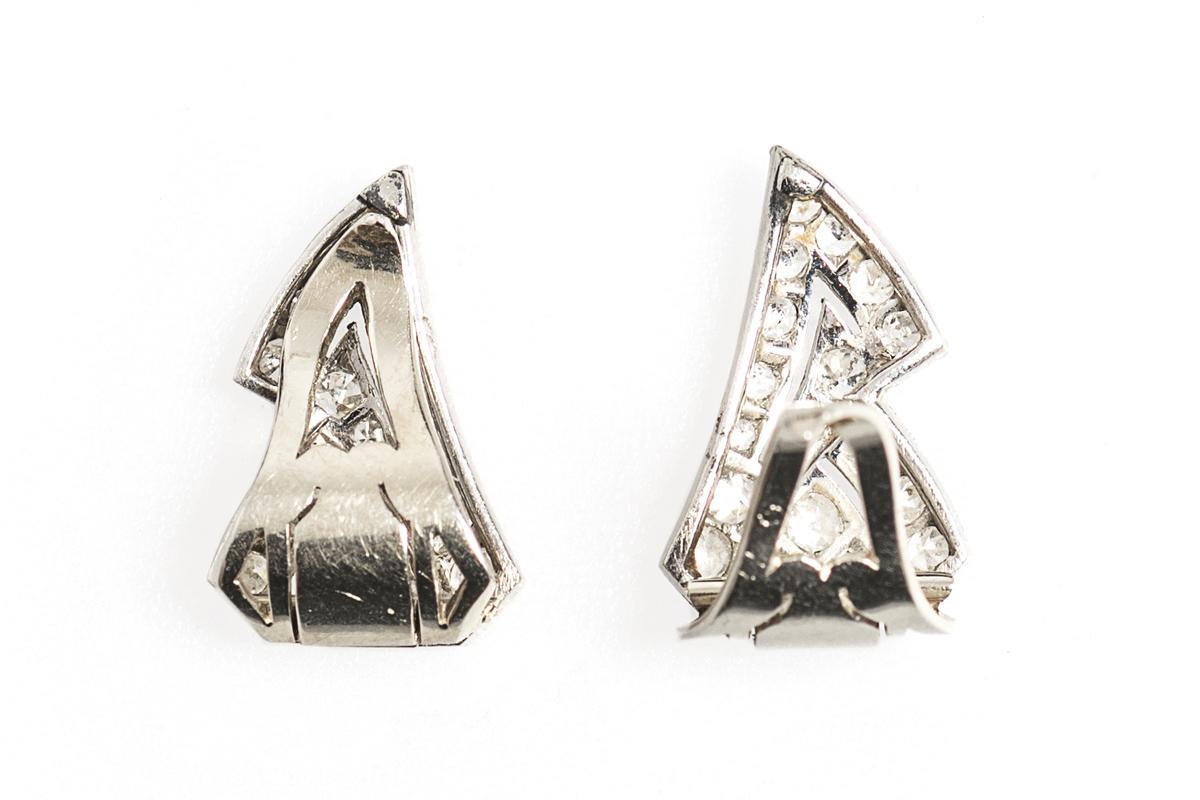 Art Deco Diamond Earrings of Stylised Ribbons in Platinum, French circa 1925.