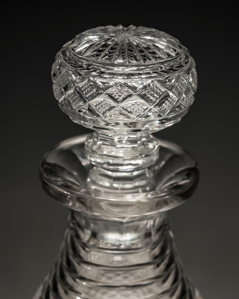 A pair of step and strawberry diamond cut Regency decanters