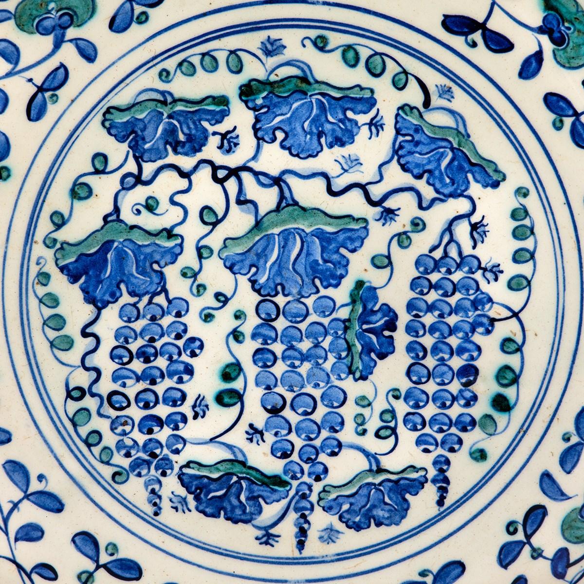 A Large Rimless Iznik Dish Decorated with Grapes