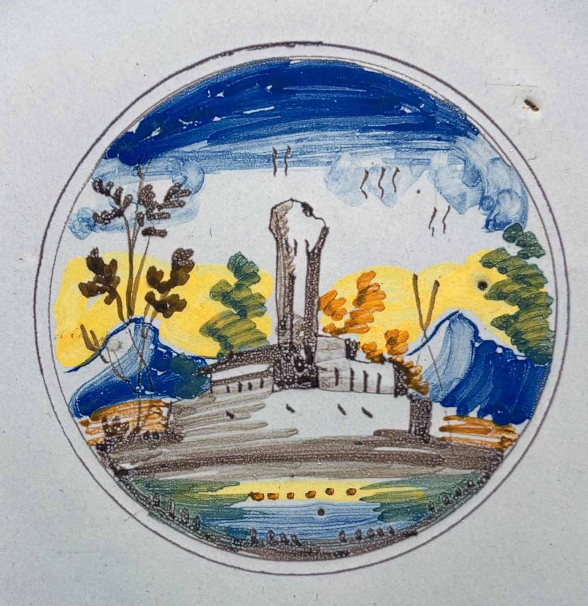 Italian pottery faience plate with painting of a church near mountains circa 1700