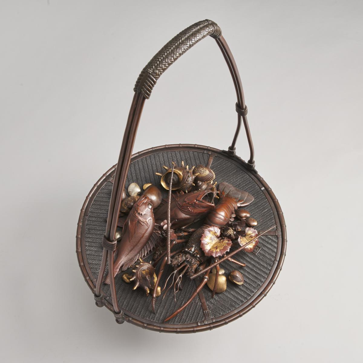 An elaborate Japanese, Meiji-era bronze and multi-metal basket of seafood Signed Joun