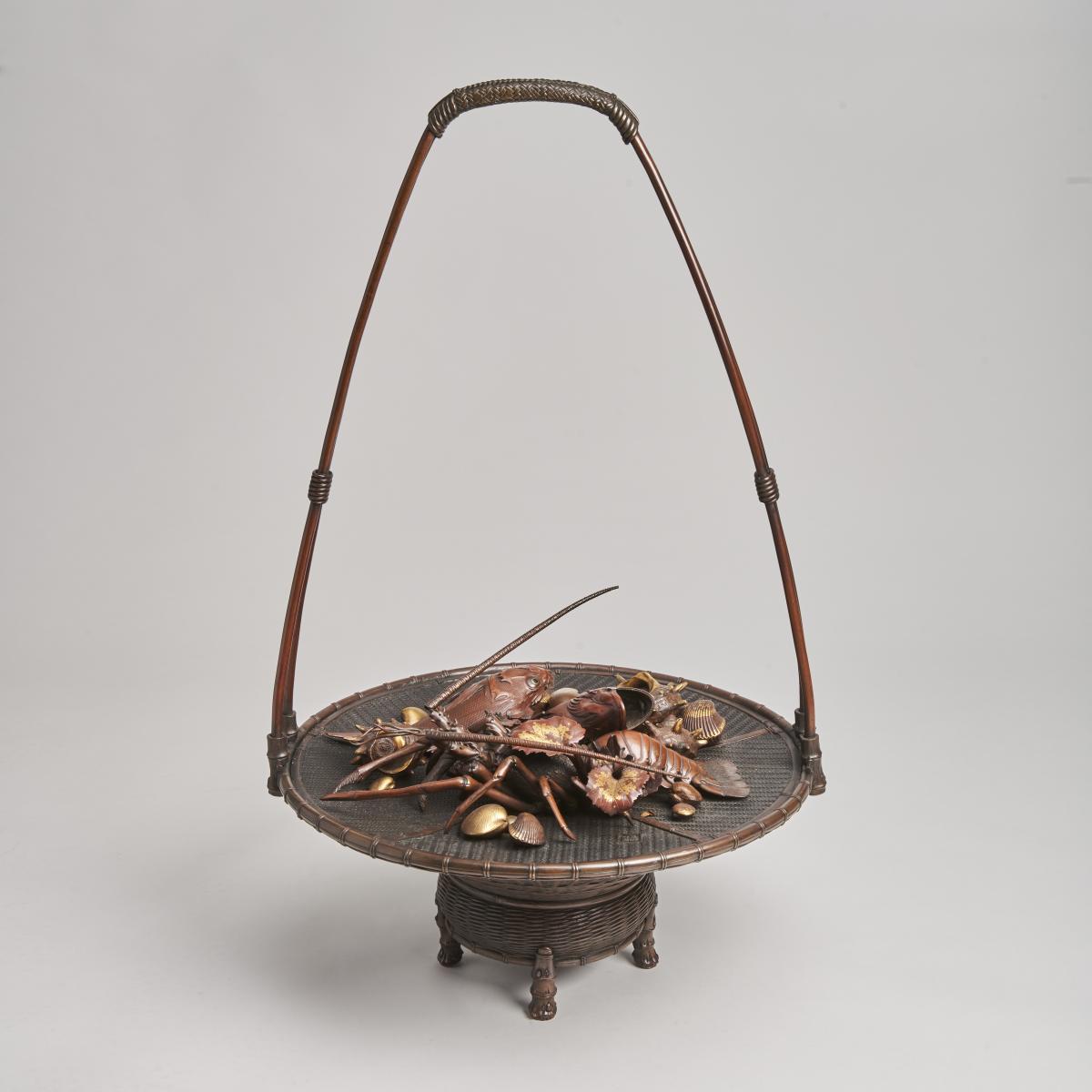 An elaborate Japanese, Meiji-era bronze and multi-metal basket of seafood Signed Joun