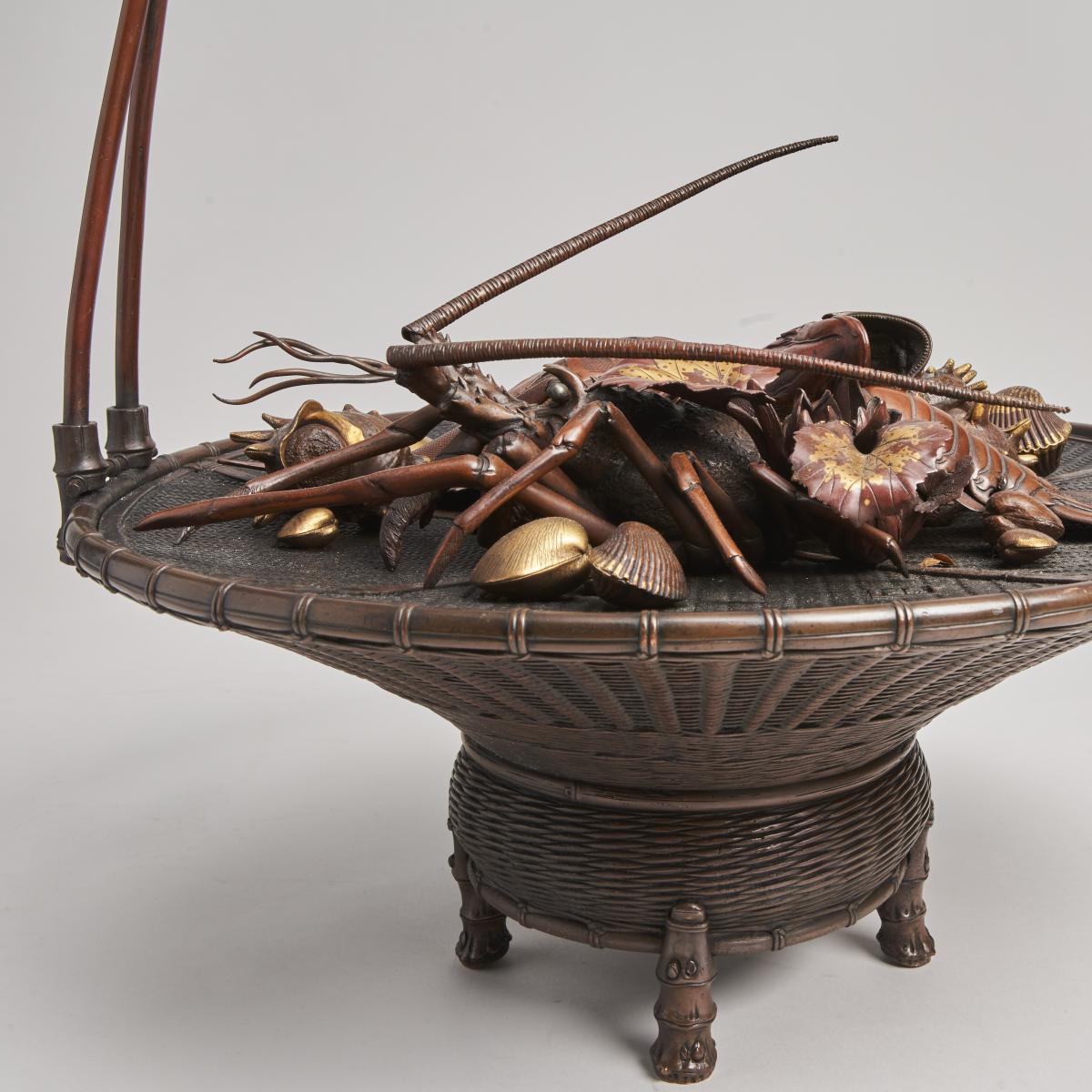 An elaborate Japanese, Meiji-era bronze and multi-metal basket of seafood Signed Joun