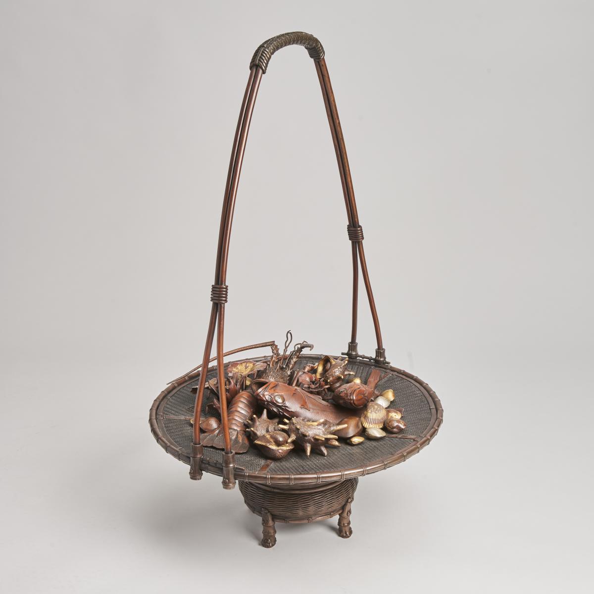 An elaborate Japanese, Meiji-era bronze and multi-metal basket of seafood Signed Joun