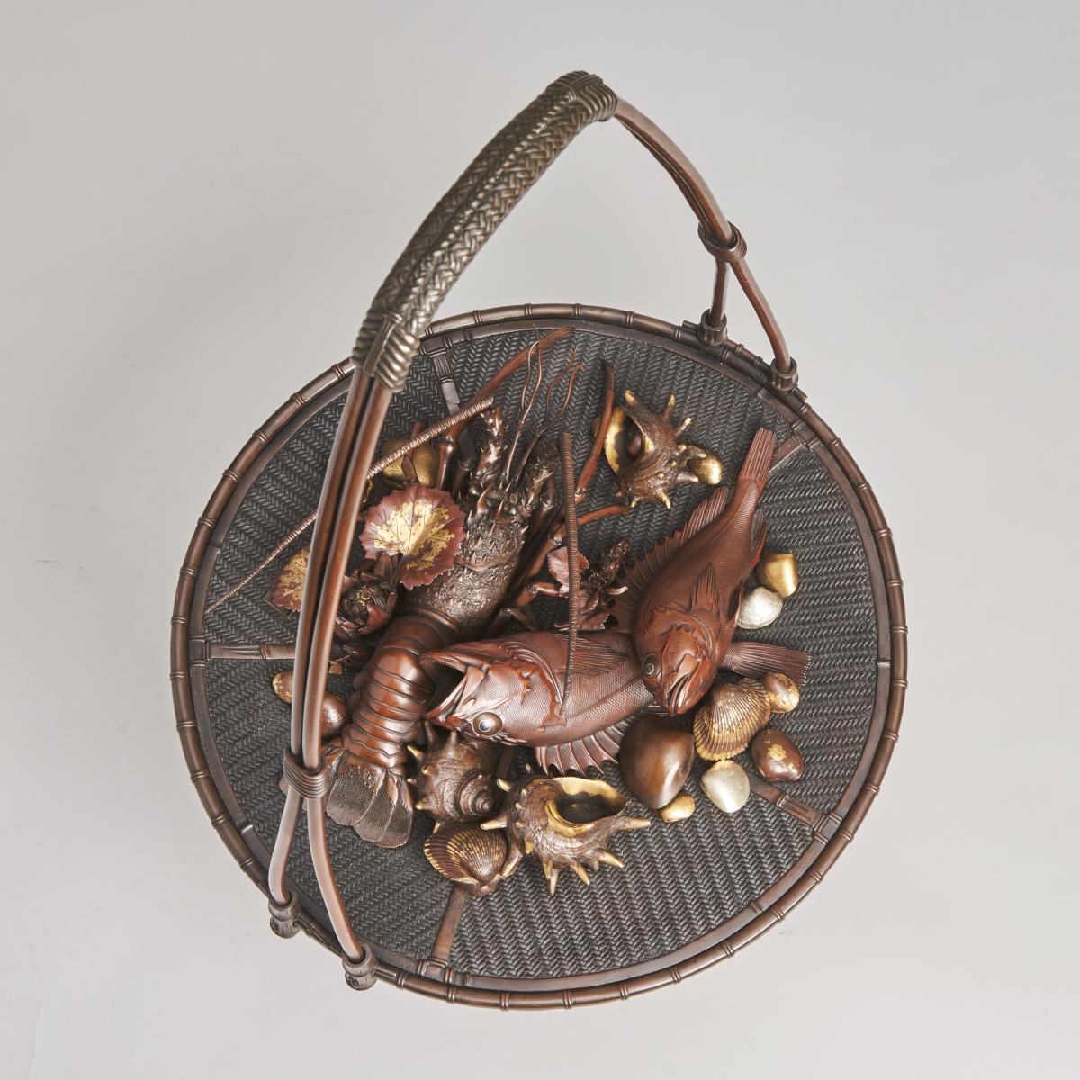 An elaborate Japanese, Meiji-era bronze and multi-metal basket of seafood Signed Joun