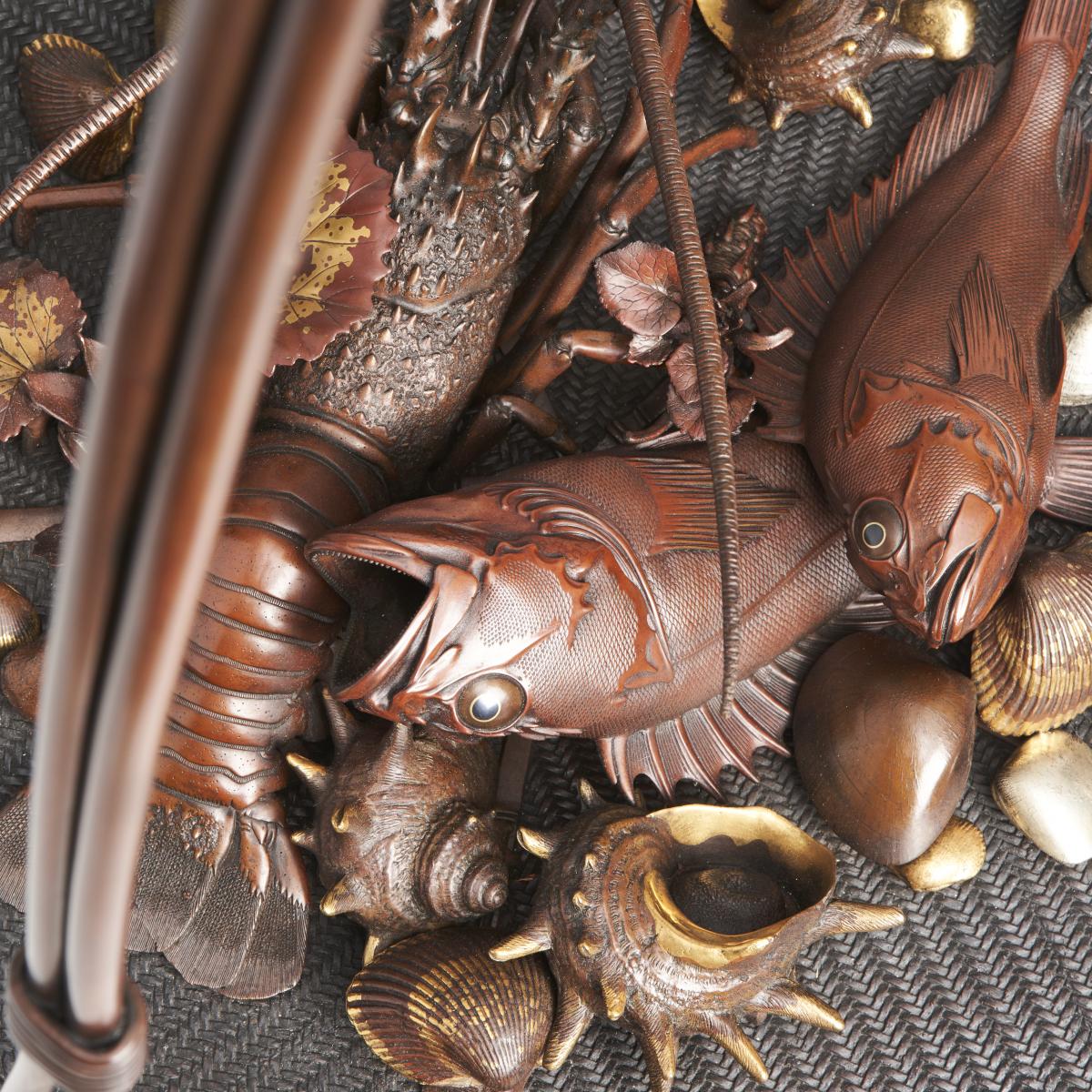 An elaborate Japanese, Meiji-era bronze and multi-metal basket of seafood Signed Joun