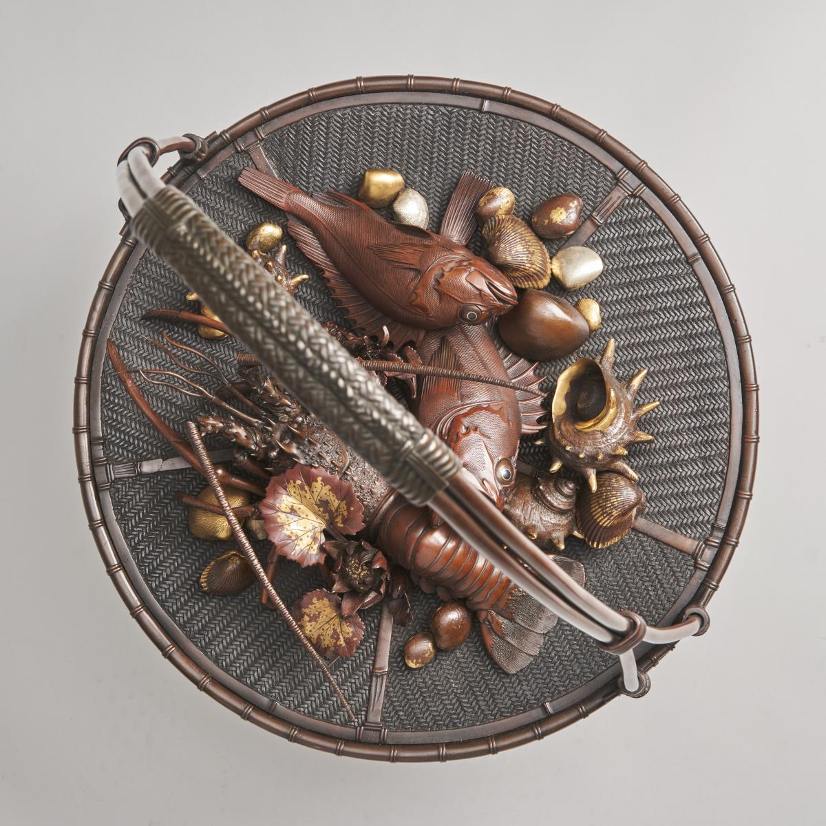 An elaborate Japanese, Meiji-era bronze and multi-metal basket of seafood Signed Joun