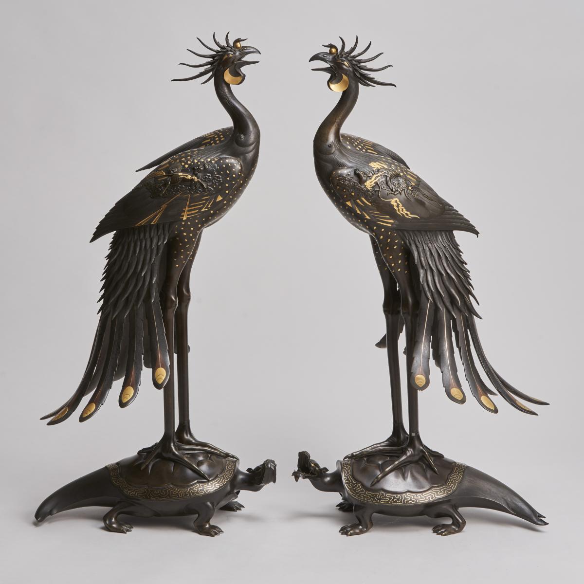 An exceptional pair of multi metal Phoenixes mounted on turtles (Japanese, 1868 - 1912)