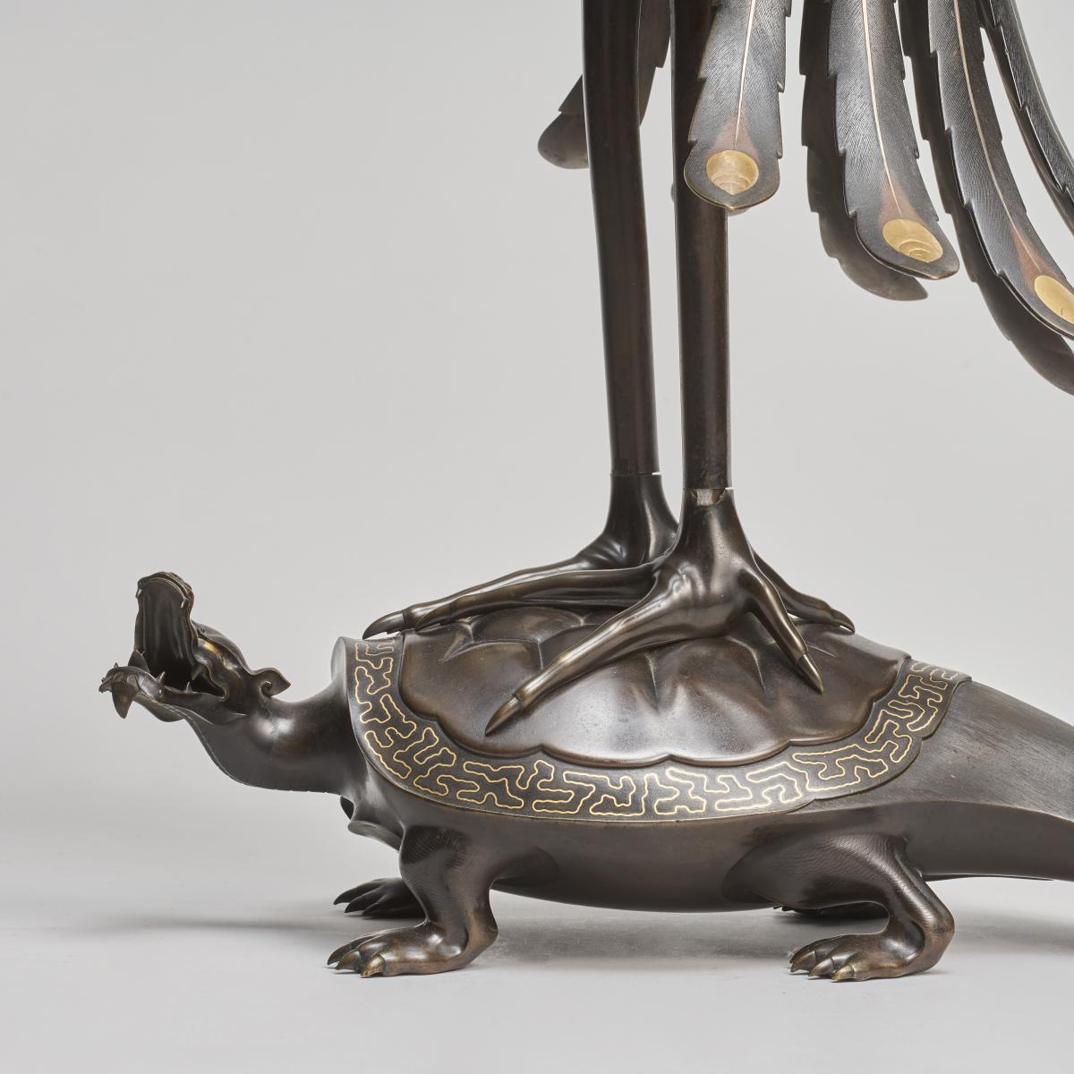 An exceptional pair of multi metal Phoenixes mounted on turtles (Japanese, 1868 - 1912)