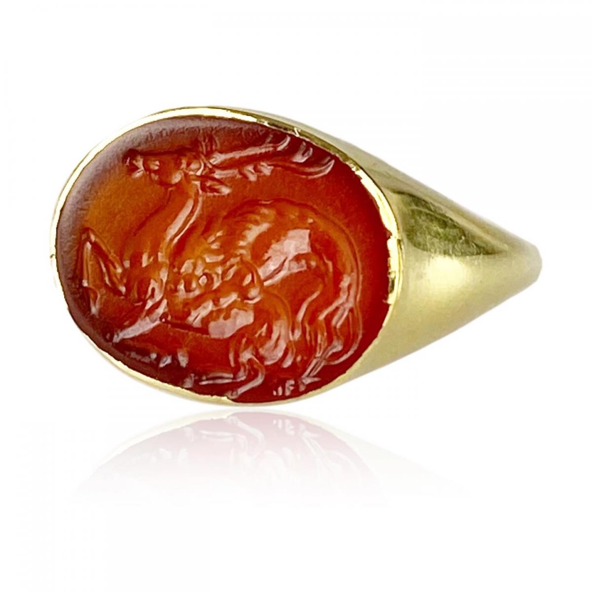 Agate scaraboid ring engraved with a lion seizing a deer. Greek, 5th century BC