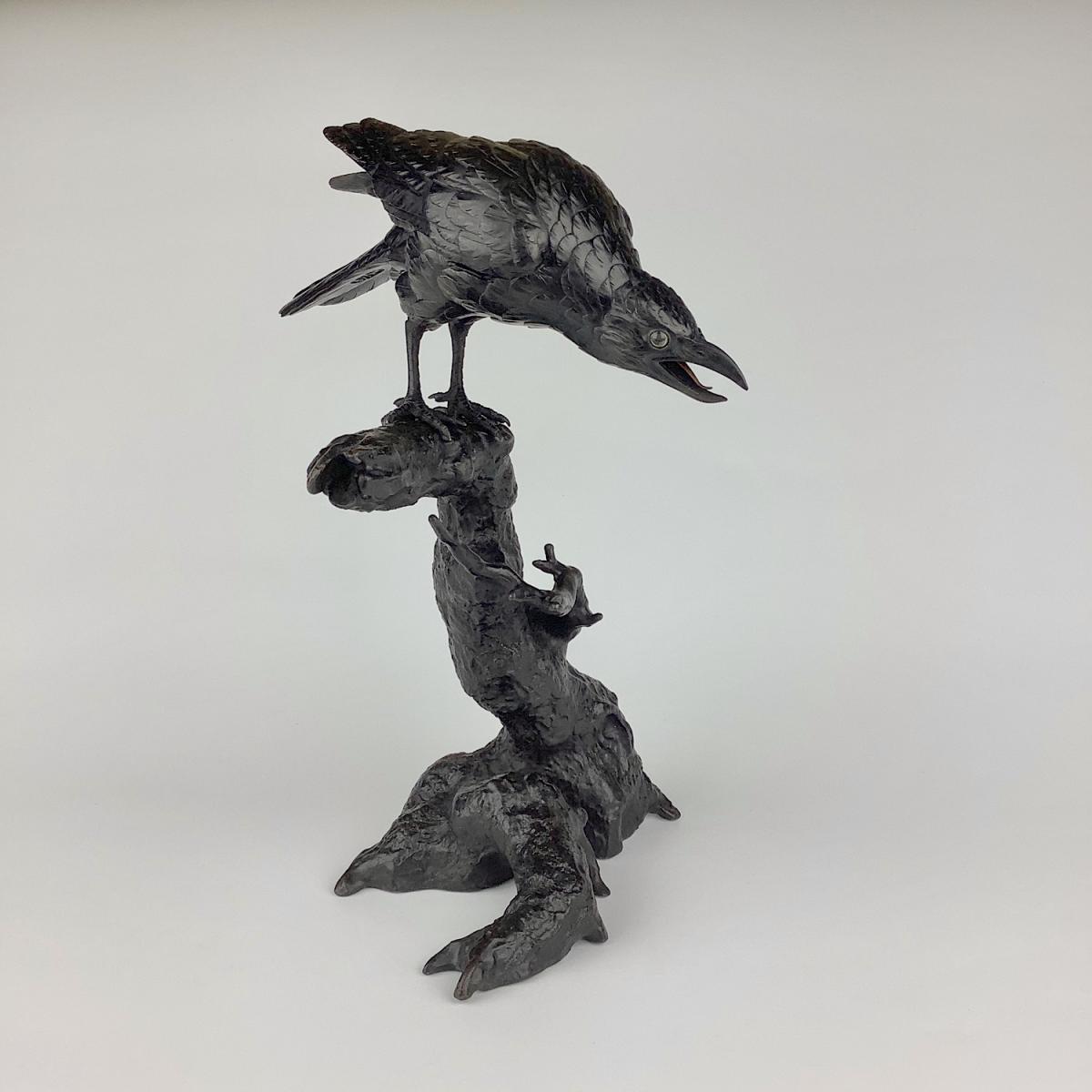 Japanese bronze crow on a tree trunk signed Mitani, Meiji Period.