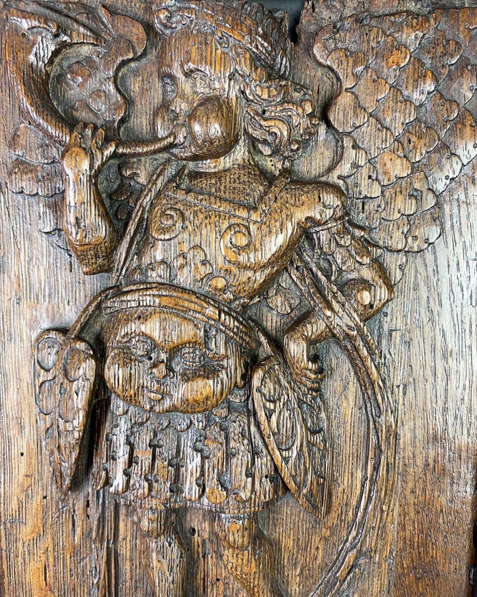 Oak relief of Saint Micheal blowing a horn. French, mid 16th century