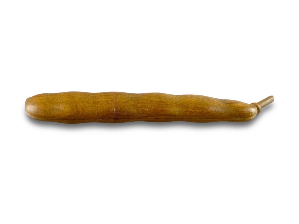 Fruitwood needle case in the form of a runner bean. French, 19th century