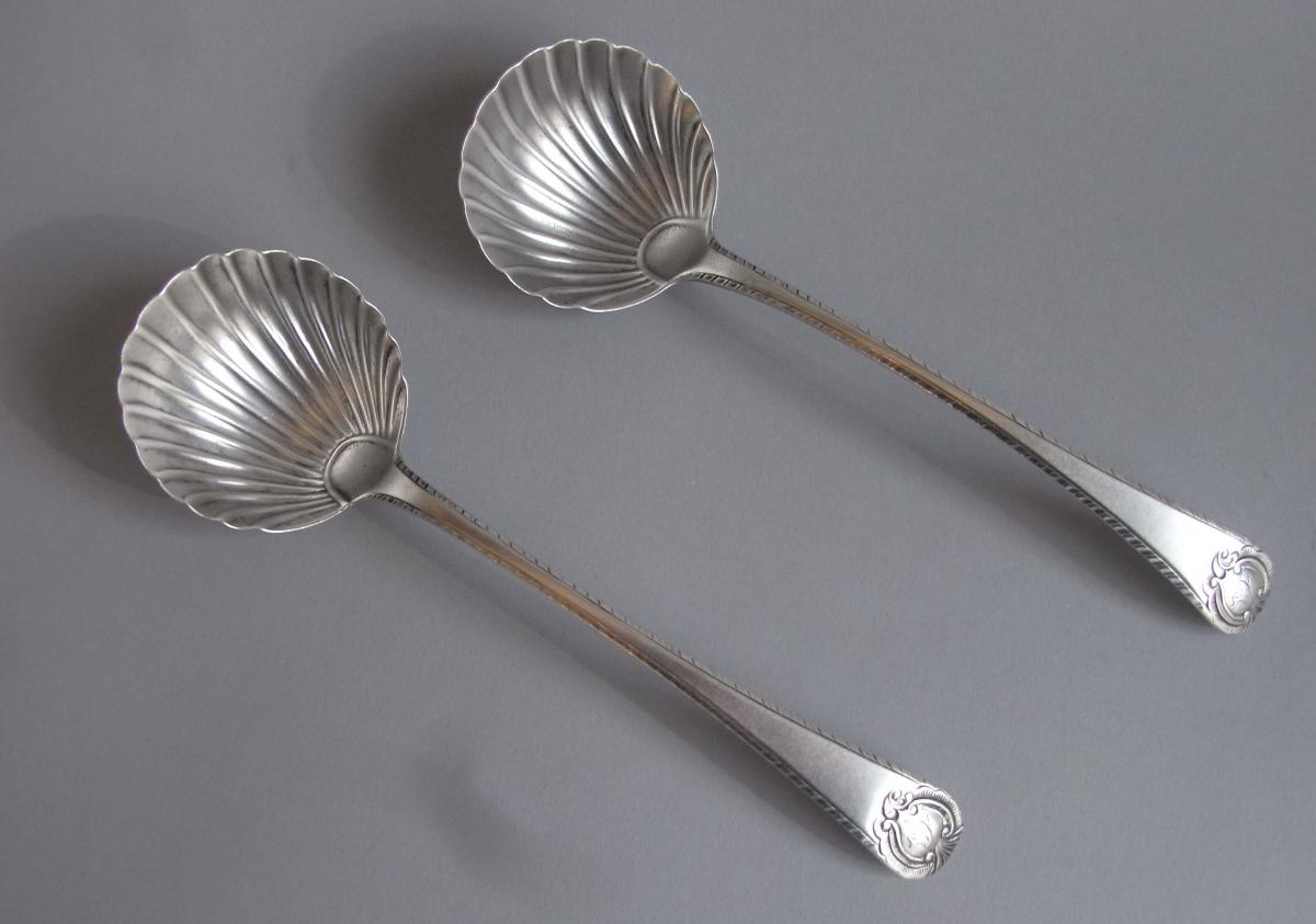 A rare pair of George III 'Carrington Shield' Sauce Ladles made in London in 1771 by George Smith